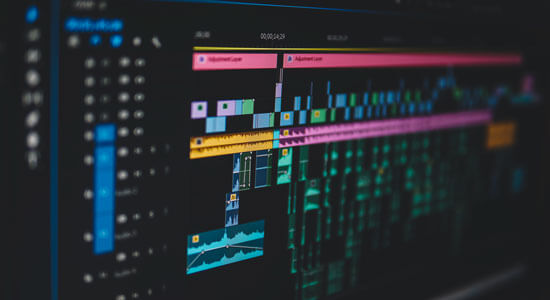 A Data Projections monitor displaying Premiere editing software