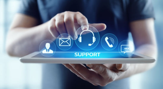 A man pointing towards a holographic support icon