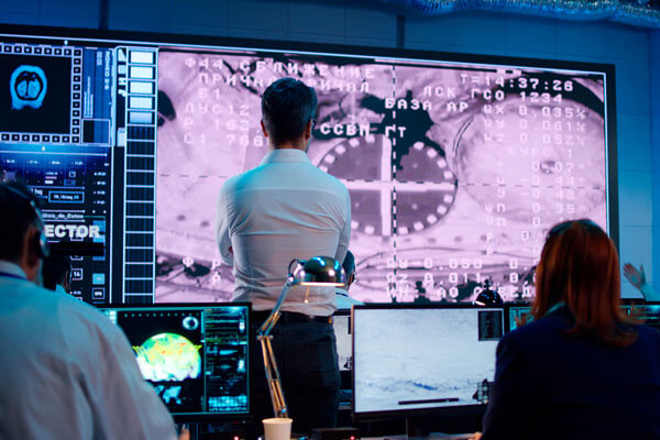 Doctors looking at visualized data on a Data Projections's screen