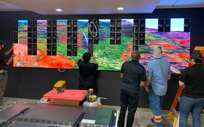 A video wall being installed by Data Projections crewmen