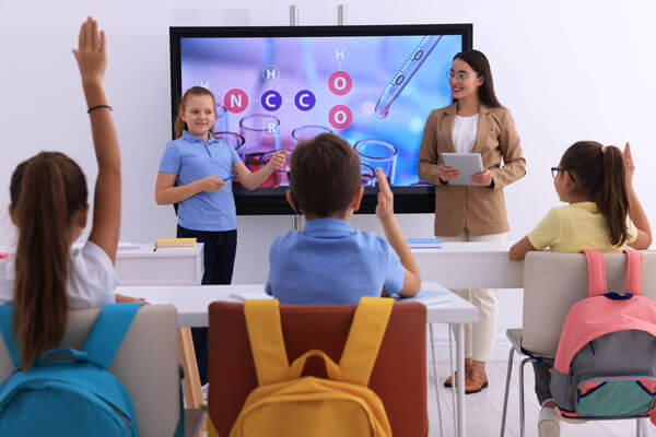 A teacher using a Data Projections portable display for a presentation